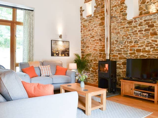 Welcoming living area with wood burner | The Horse Gin - Higher Blagrove Farm Cottages, East Worlington, near South Molton