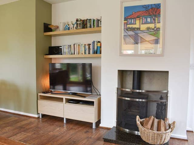 Living room with wood burner | Mussel Cottage, Elmer