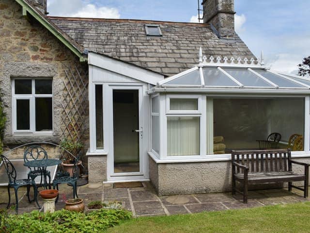 Paved patio with bench seating | Underhill Cottage, Arnside, near Grange-over-Sands