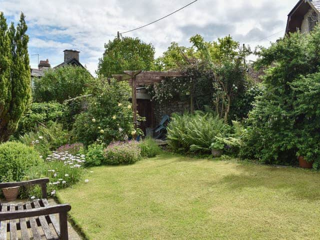 Lovely lawned garden with well-established borders | Underhill Cottage, Arnside, near Grange-over-Sands