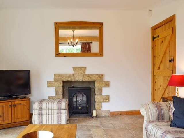 Comfy living room with patio doors | Holly Cottage, Handley, near Matlock