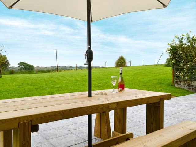 Paved patio area with shady seating  | Heath Farm - Old Mill - Heath Farm , Bradworthy, near Hartland