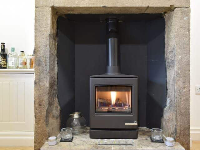 Warming wood-burner style gas fire | Easter Cottage, Bamford, near Hope Valley