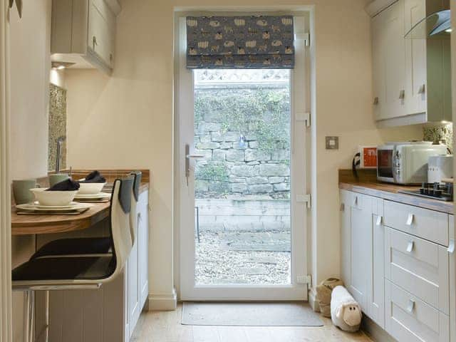 Kitchen with door to courtyard | Easter Cottage, Bamford, near Hope Valley