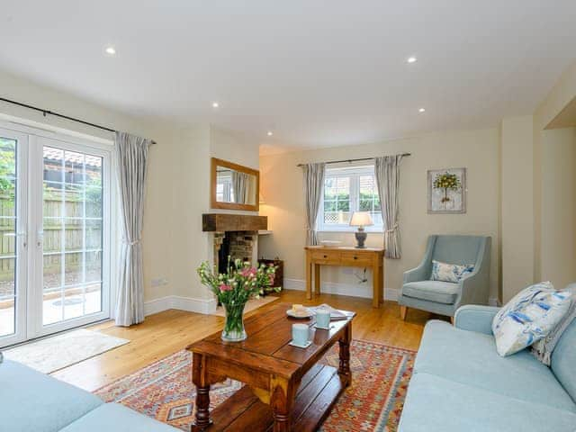 Comfortable bedroom with wood burner | Sea Lavender Cottage - Hall Lane Cottages, Thornham, near Kings Lynn