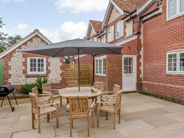 Enclosed courtyard with sun deck, garden furniture and BBQ | Sea Lavender Cottage - Hall Lane Cottages, Thornham, near Kings Lynn