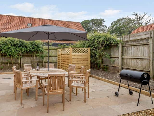 Enclosed courtyard with sun deck, garden furniture and BBQ | Sea Lavender Cottage - Hall Lane Cottages, Thornham, near Kings Lynn