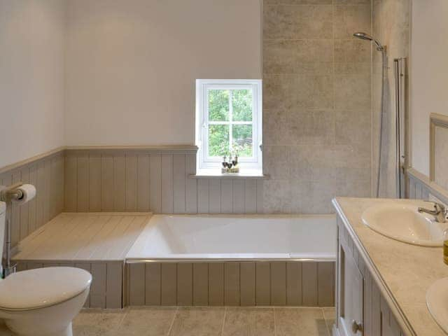 Bathroom with shower over bath | Walnut Tree House, Tilney St Lawrence, near Kings Lynn