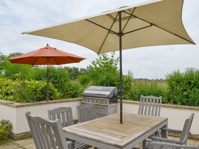 Patio area with BBQ and outdoor furniture | Walnut Tree House, Tilney St Lawrence, near Kings Lynn