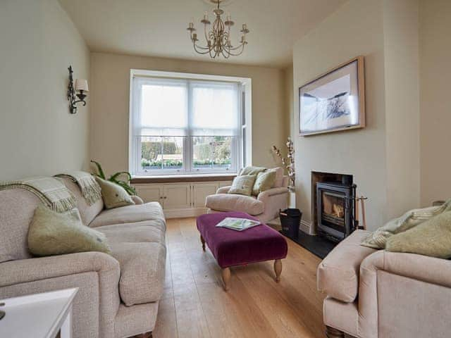 Relaxing living room with cosy log burner | Hydrangea House, Hythe