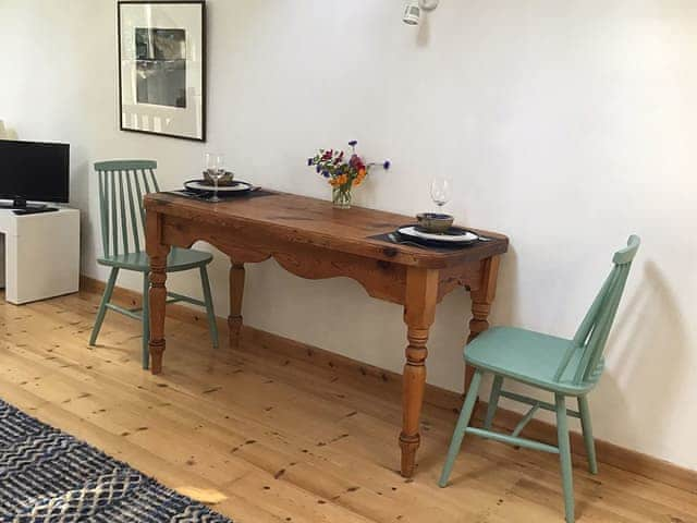 The dining table in the living area | The Studio, Hoe, near Dereham