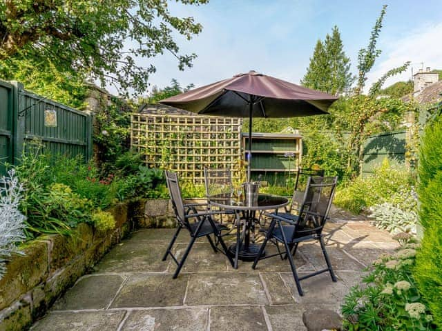 Paved patio area with outdoor furniture | Whibberley Cottage, Ashford-in-the-Water, near Bakewell