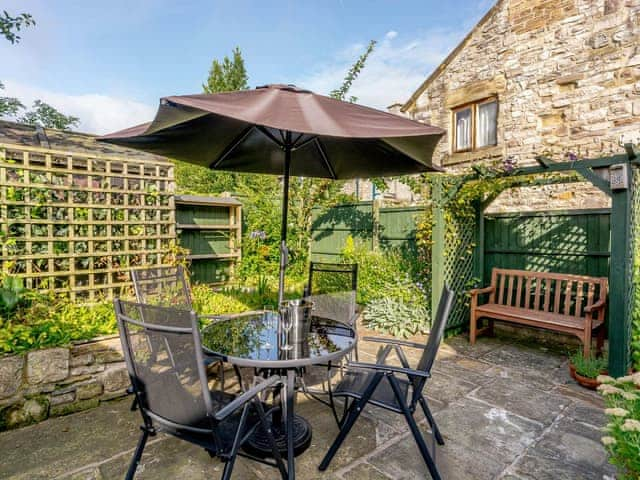 Outdoor seating area on the patio | Whibberley Cottage, Ashford-in-the-Water, near Bakewell