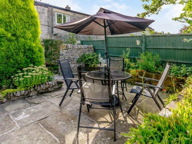 Enclosed patio area with outdoor furniture | Whibberley Cottage, Ashford-in-the-Water, near Bakewell