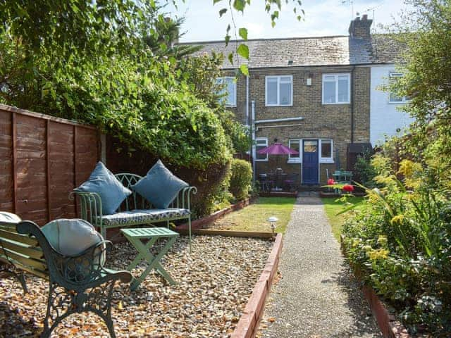 Enclosed garden with terrace and furniture | Shingle Cottage, Whistable