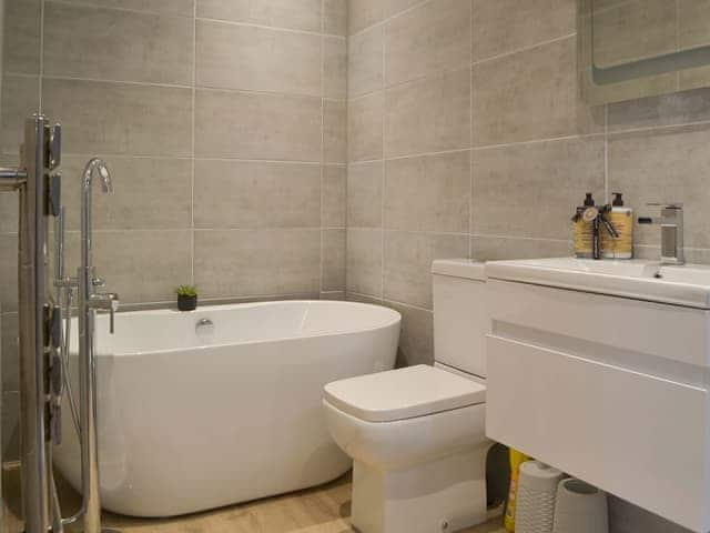 Wonderful bathroom with modern standalone bath tub | Riversdale - Grange End Cottages, Grasmere