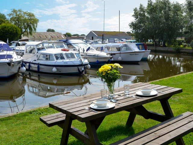 Sitting-out-area with riverside views | Ardea - Simpson&rsquo;s Boatyard, Stalham