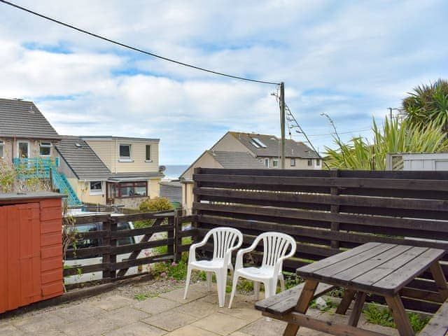 Patio with sea views | Barbara Anne&rsquo;s - Porthtowan Holiday Apartments, Porthtowan, near Truro