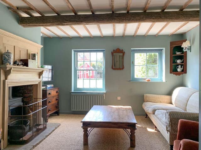 Welcoming living area with wood burner | Coastguard&rsquo;s Cottage, Burnham Overy Staithe, near Burnham Market