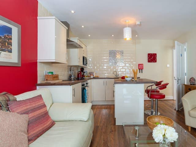 Cosy living space and adjacent kitchen area | The Starfish - Harbour Lights, Brixham