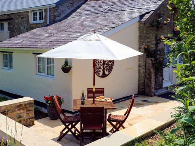 Patio with garden furniture and barbecue | The Linney - Cartole Cottages, Pelynt, near Looe