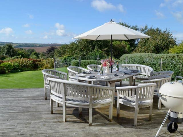 Large decked area with table and chairs overlooking the garden | Buddleia, West Charleton, near Kingsbridge