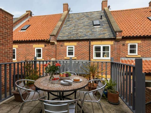 Patio area with outdoor furniture | Endeavour Cottage, Whitby