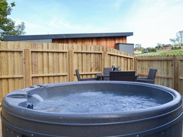 Let the hot tub soak away your aches and pains | Curlew Lodge - Wallace Lane Farm Cottages, Brocklebank, near Caldbeck and Uldale