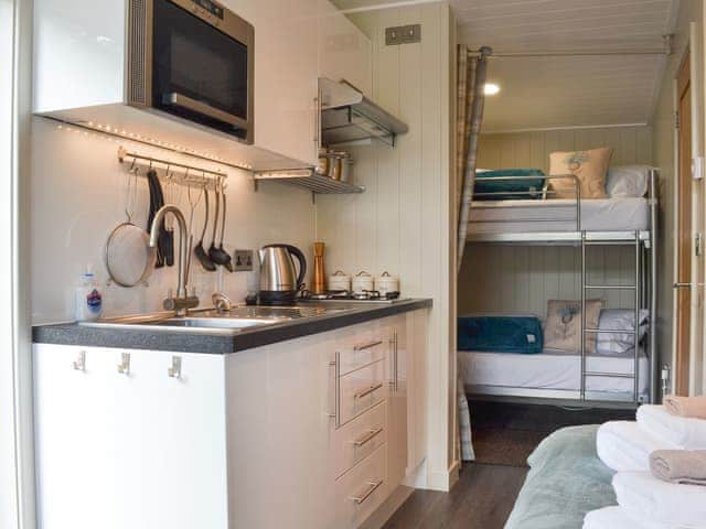 Kitchen and bunk bedroom | Lapwing - Wallace Lane Farm Cottages, Brocklebank, near Caldbeck and Uldale