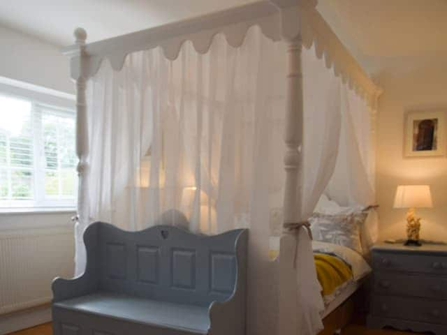 Beautiful four poster bedroom | Woodbrook Cottage, Bothenhampton, near Bridport