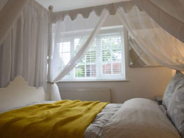 Beautiful four poster bedroom | Woodbrook Cottage, Bothenhampton, near Bridport