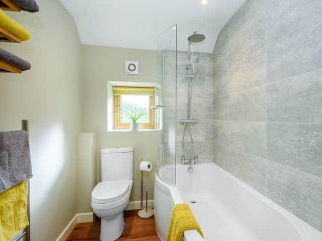 Bathroom with shower over bath | Stackyard Cottage, Skeyton, near North Walsham