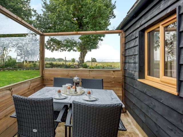 Inviting patio area | Stackyard Cottage, Skeyton, near North Walsham