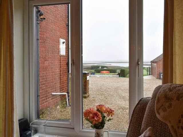 View from the living area | Vista Cottage - Sea Marsh Cottages, Brancaster Staithe, near Wells-next-the-Sea