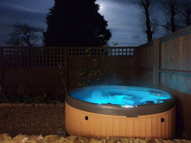 Hot tub lit up at night | The Stables - Kingates Farm, Whitwell, near Ventnor