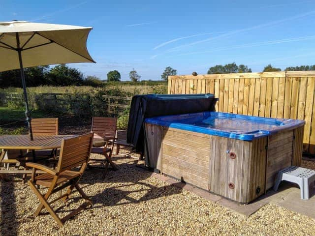 Large hot tub with views of the paddock and open fields | Walnut Tree House, Tilney St Lawrence, near Kings Lynn