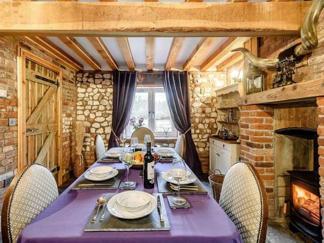 Formal dining room with wood burner | Honey Pots, Foulden, near Swaffham