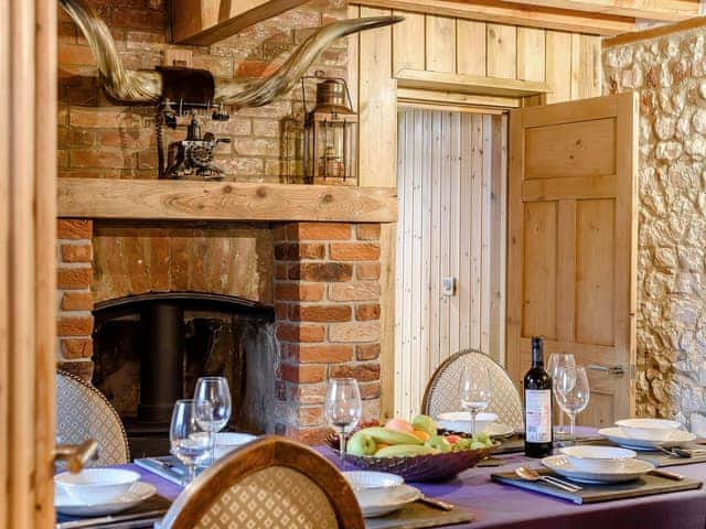 Formal dining room with wood burner | Honey Pots, Foulden, near Swaffham