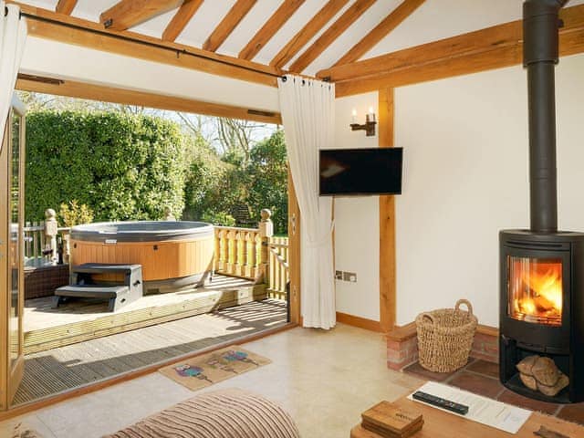 Delightful living area with cosy wood burner | Owls Hoot - Serenity Cottages, Stoke Ash, near Eye