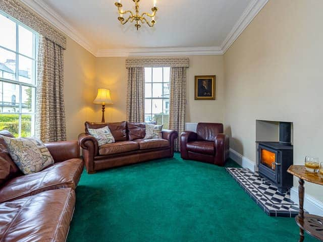 Spacious living room with wood burner | Langford Villa, Filey