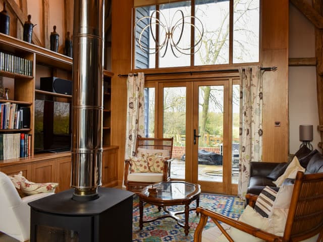 Cosy living area with wood burner | Ivy Todd Barn, Ashdon, near Saffron Walden