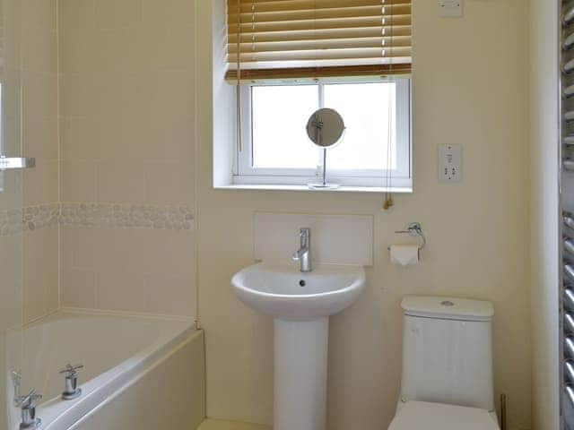 Bathroom with shower over bath | The Parade Apartment - The Bay, Filey, near Scarborough