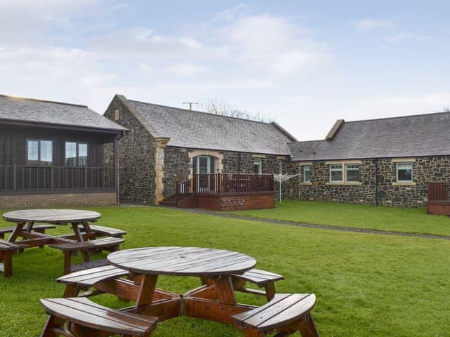 Delightful stone-built holiday home with lawned garden area | Driftwood Cottage, Newton-by-the-Sea, near Alnwick