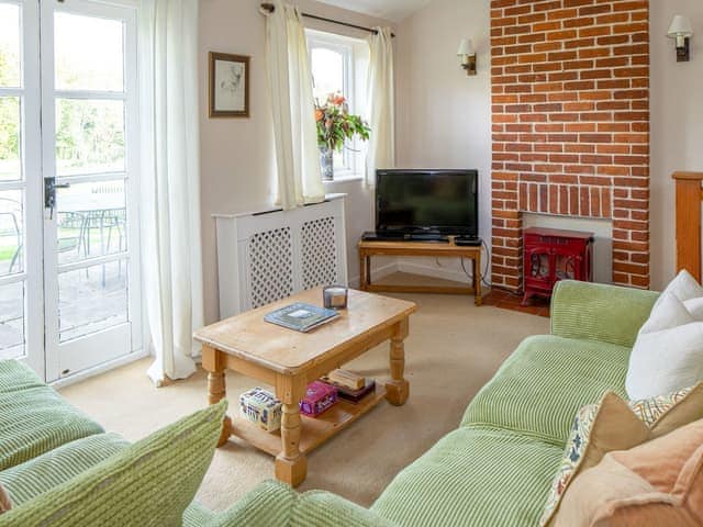 Comfortable living room | The Old Stable - Marshwood Manor Cottages, Bettiscombe, near Lyme Regis