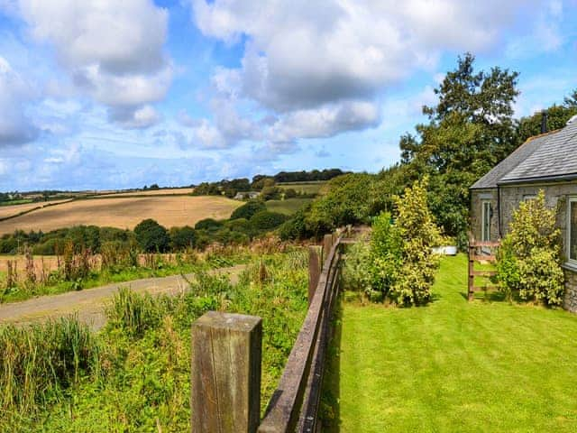 Garden with delightful views | Swallows Barn - Gwedna Barns, Godolphin Cross, Helston