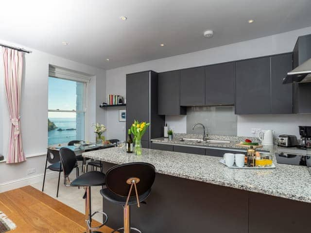 The modern kitchen has granite work surfaces | St Catherines Court No 4, Fowey