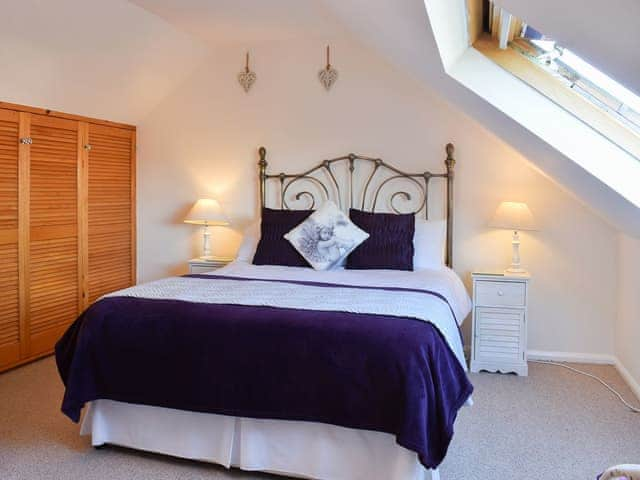 Relaxing bedroom with antique style bed | What A View!, Whitby