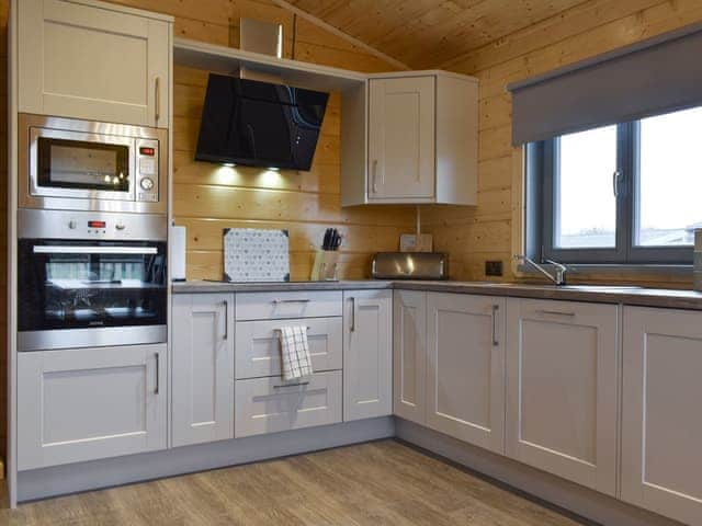 Fully equipped kitchen within the open-plan design | Larch Lodge, Cedar Lodge - Dale Garth Lodges, Mascalles, near Ulverston