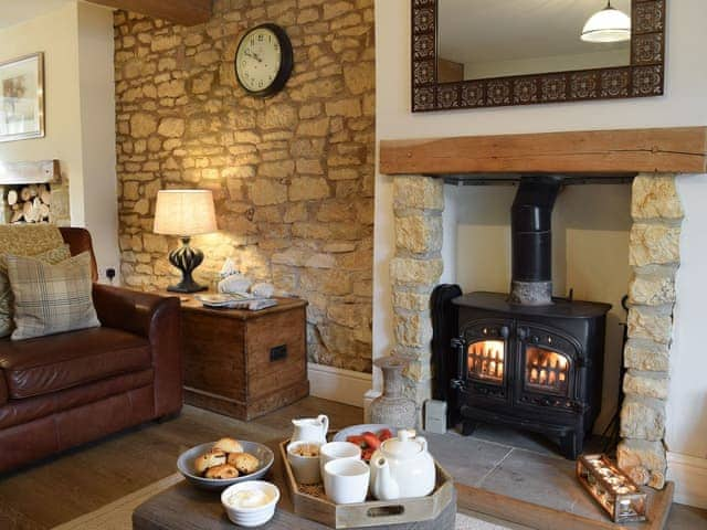 Living room with wood burner | Spring Cottage, Bourton-on-the-Water