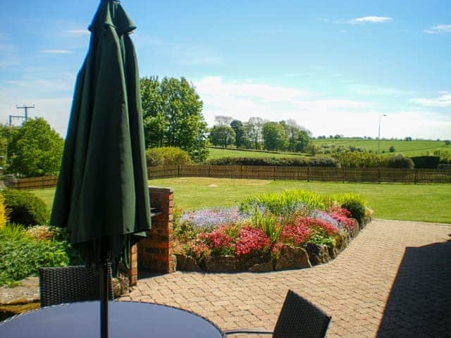 Spacious garden with patio and furniture | Meadowside Cottage, Calton Moor, near Ashbourne